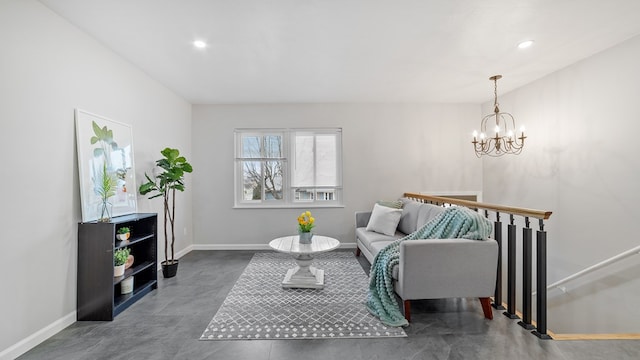 living room with recessed lighting, a notable chandelier, and baseboards