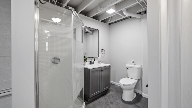 full bathroom featuring a stall shower, vanity, toilet, and baseboards