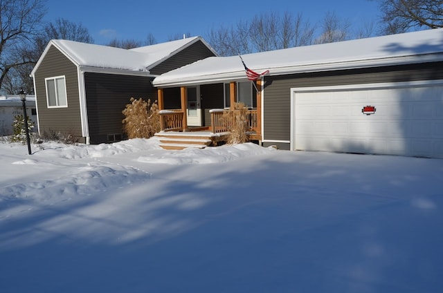 ranch-style house with covered porch and a garage