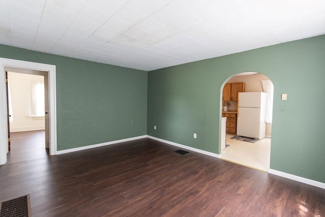 942 Lenox Ave, Mansfield, OH 44906 - spare room with arched walkways and wood finished floors