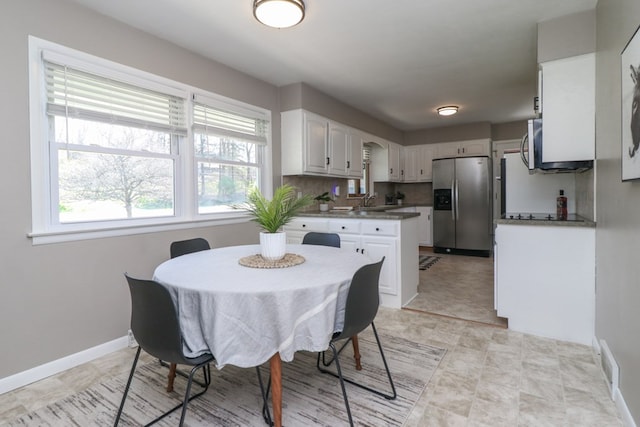 dining room with baseboards