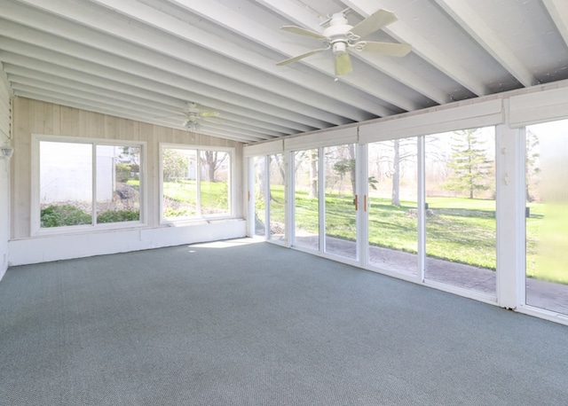 unfurnished sunroom with a ceiling fan