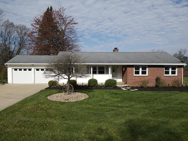 ranch-style home featuring a chimney, a front lawn, concrete driveway, an attached garage, and brick siding