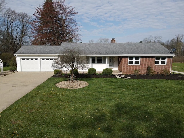 ranch-style home with a chimney, a front lawn, concrete driveway, a garage, and brick siding