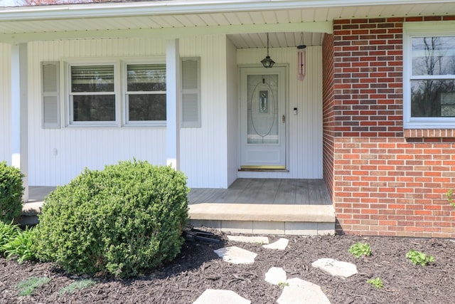 property entrance with brick siding