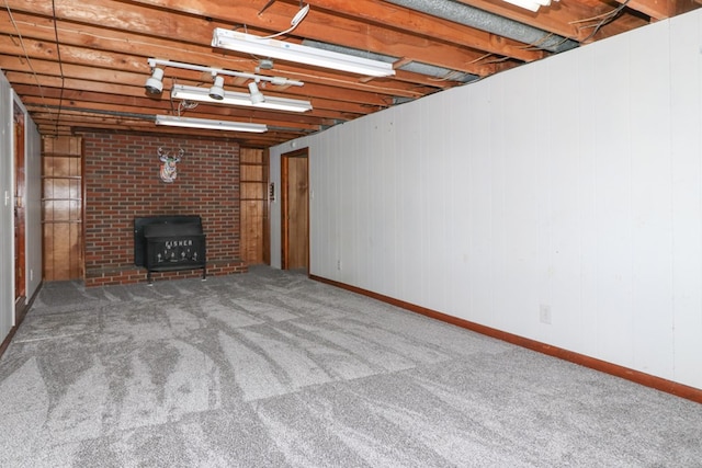 finished basement with baseboards and carpet flooring