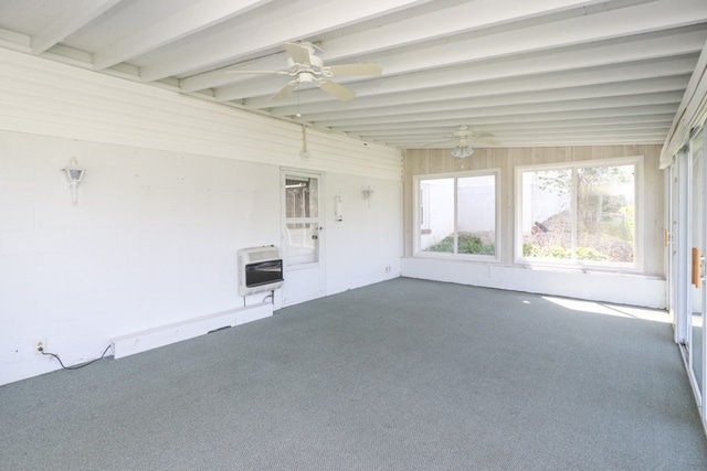 unfurnished sunroom with heating unit and ceiling fan