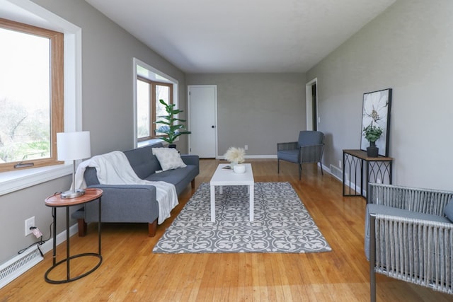 living room with wood finished floors and baseboards