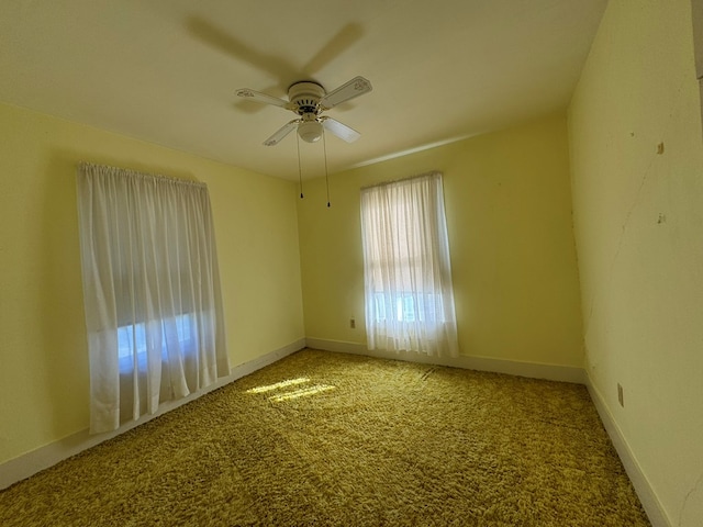 carpeted empty room with ceiling fan