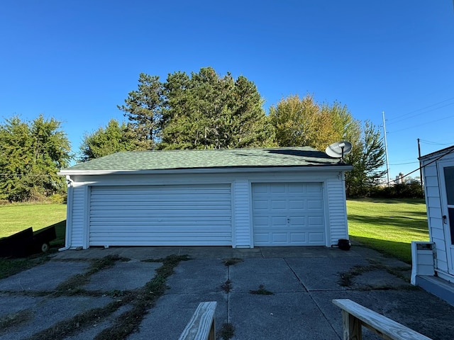 garage with a lawn