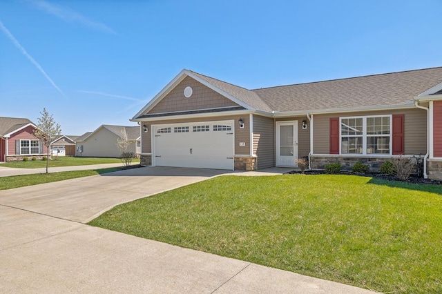 view of front of property with an attached garage, driveway, and stone siding