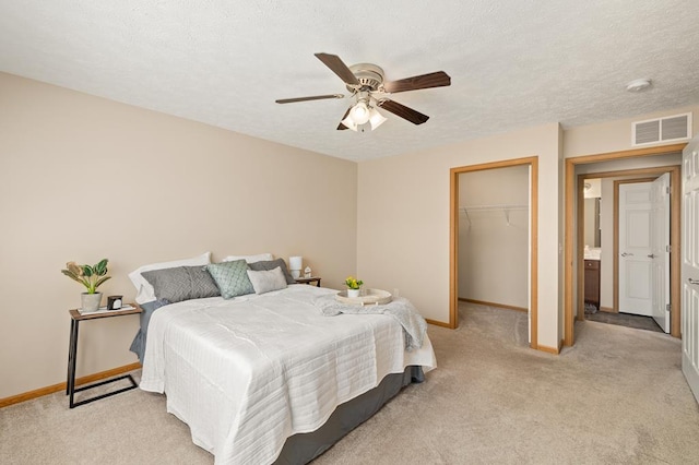 bedroom featuring light colored carpet, baseboards, and visible vents