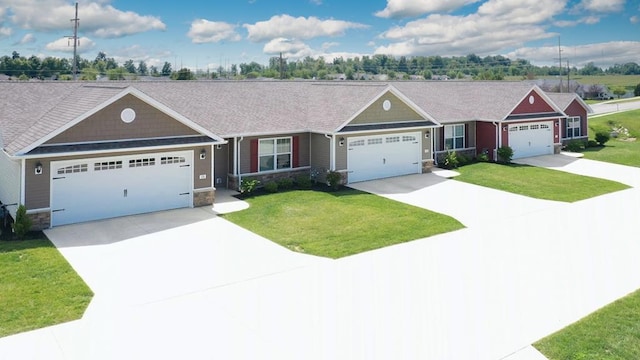 view of front of home featuring concrete driveway, a garage, stone siding, and a front lawn