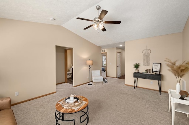 living area with visible vents, lofted ceiling, baseboards, ceiling fan, and carpet flooring