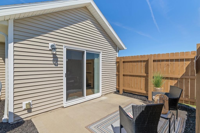 view of patio / terrace featuring fence