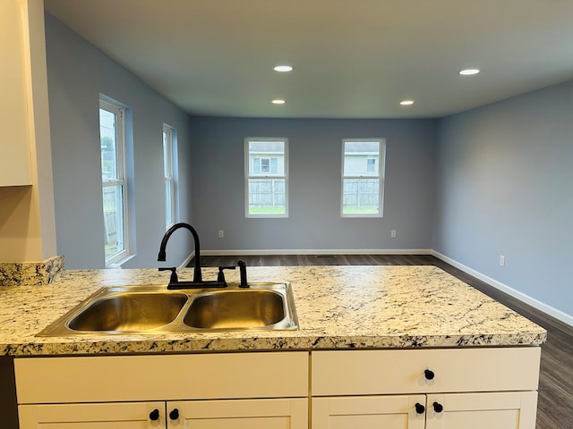 1030 Elm, Bucyrus, OH 44820 - kitchen with dark wood-style flooring, white cabinetry, and recessed lighting