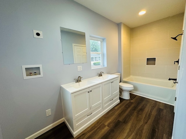 1030 Elm, Bucyrus, OH 44820 - bathroom with wood finished floors, double vanity, tub / shower combination, and recessed lighting