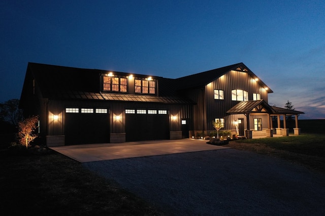 modern farmhouse style home featuring a garage