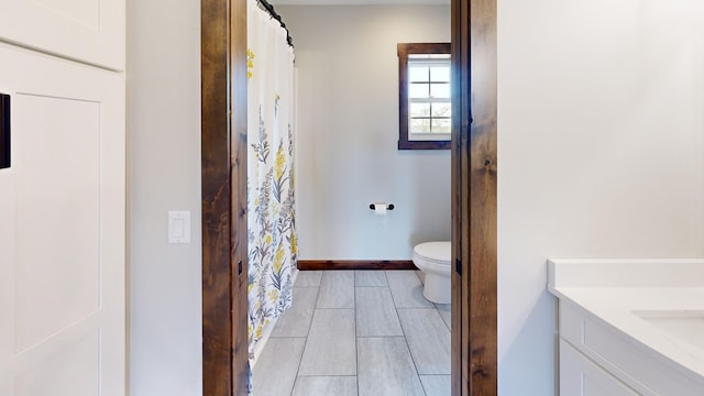 bathroom featuring vanity and toilet