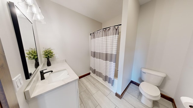 full bathroom featuring vanity, toilet, and shower / tub combo with curtain