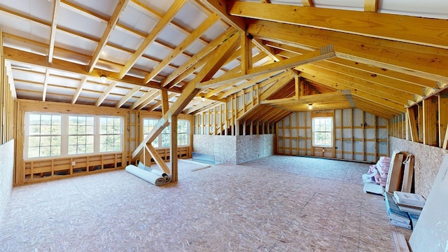 attic featuring a healthy amount of sunlight