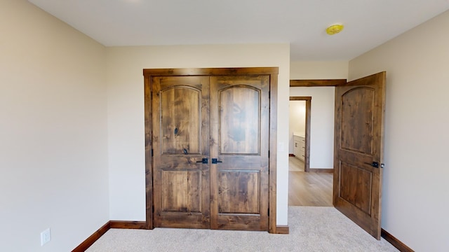 unfurnished bedroom with light carpet