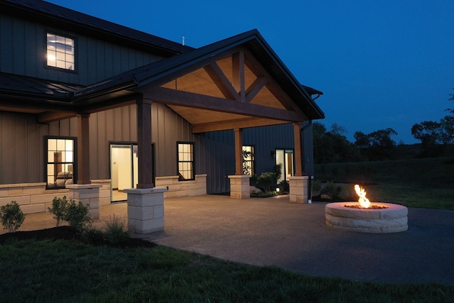 exterior space with a patio area and an outdoor fire pit