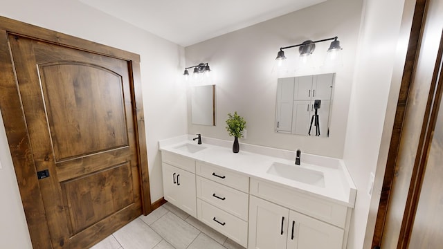 bathroom with tile patterned flooring and vanity