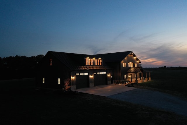 modern farmhouse featuring a garage