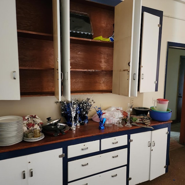 233 E Mansfield St, Bucyrus, OH 44820 - kitchen featuring white cabinets, open shelves, and butcher block counters