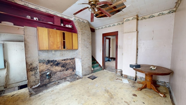 interior space with ceiling fan