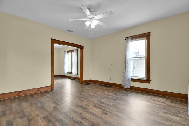97 S Gamble St, Shelby, OH 44875 - unfurnished room with baseboards, wood finished floors, and a ceiling fan