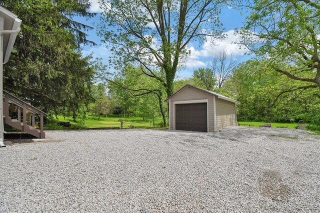 97 S Gamble St, Shelby, OH 44875 - detached garage featuring view of scattered trees