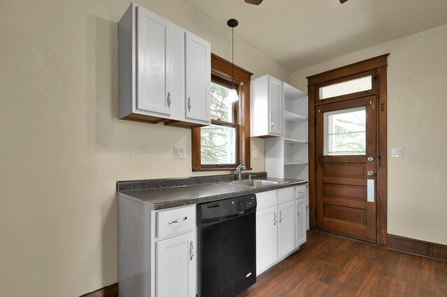 97 S Gamble St, Shelby, OH 44875 - kitchen featuring black dishwasher, a sink, dark countertops, dark wood-type flooring, and white cabinets