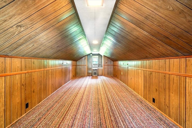 1051 Nazor Rd, Galion, OH 44833 - bonus room featuring wood walls, vaulted ceiling, and carpet flooring