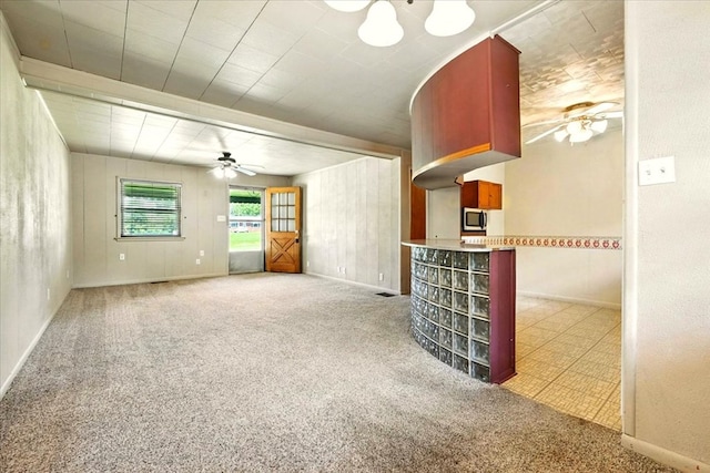 1051 Nazor Rd, Galion, OH 44833 - unfurnished living room with a ceiling fan and carpet floors