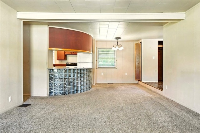 1051 Nazor Rd, Galion, OH 44833 - unfurnished living room with a chandelier and carpet