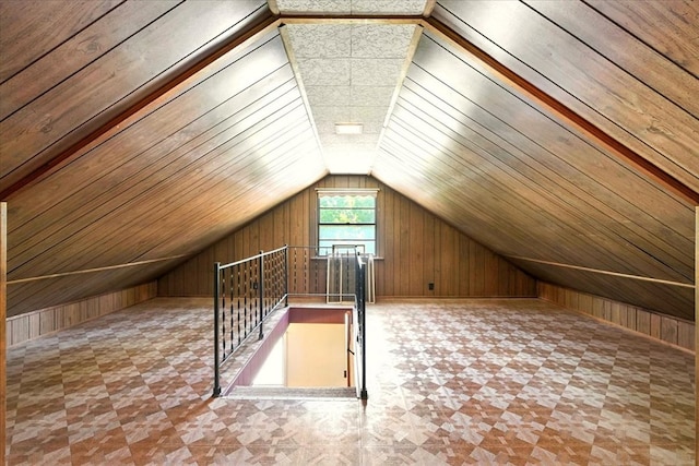 1051 Nazor Rd, Galion, OH 44833 - bonus room with wooden walls, vaulted ceiling, and tile patterned floors