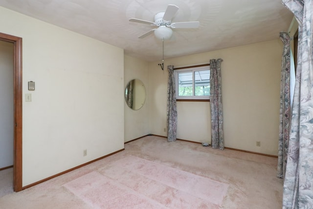 1294 Kings Corners Rd E, Lexington, OH 44904 - carpeted spare room featuring baseboards and a ceiling fan