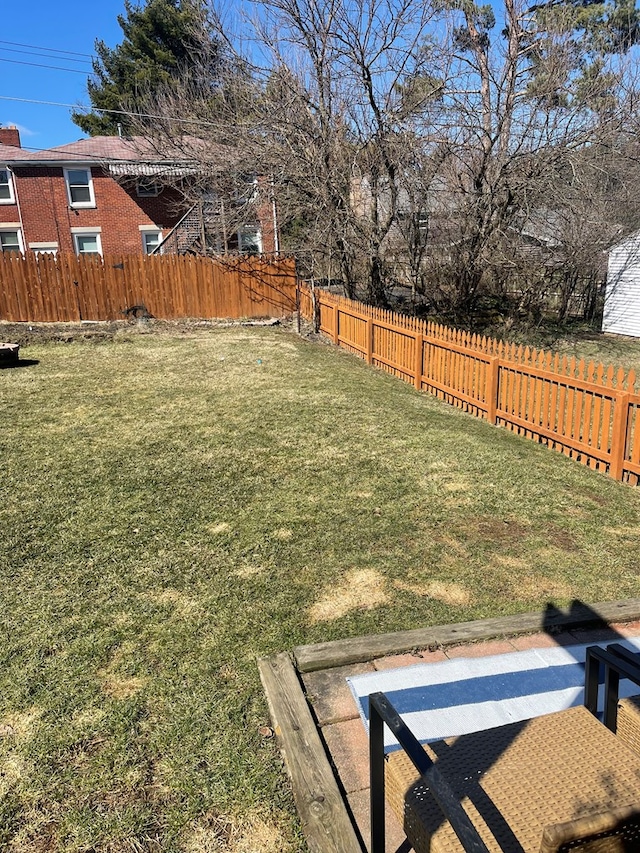 view of yard with a fenced backyard