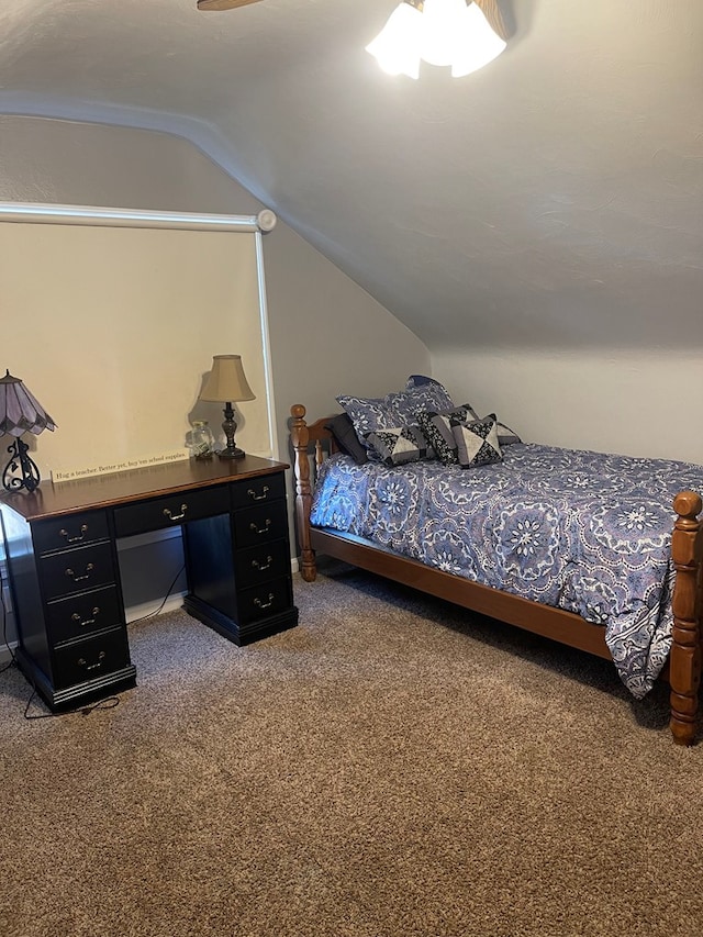 carpeted bedroom with lofted ceiling