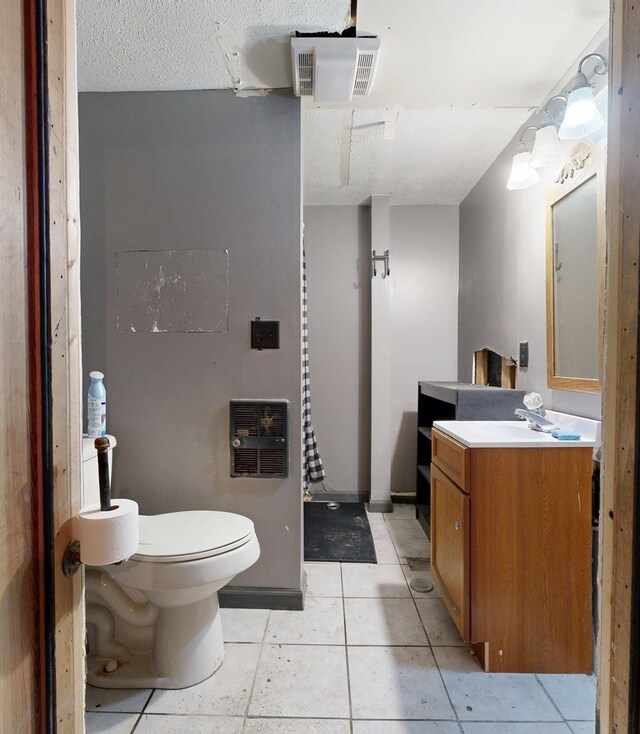 4 Post St, Shelby, OH 44875 - bathroom featuring vanity, tile patterned flooring, and heating unit