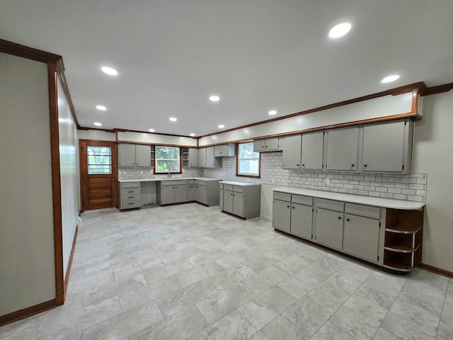 423 Beechwood Dr, Galion, OH 44833 - kitchen featuring gray cabinetry, backsplash, baseboards, recessed lighting, and a sink