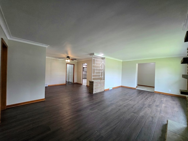 423 Beechwood Dr, Galion, OH 44833 - unfurnished living room with ceiling fan, dark wood finished floors, baseboards, and crown molding