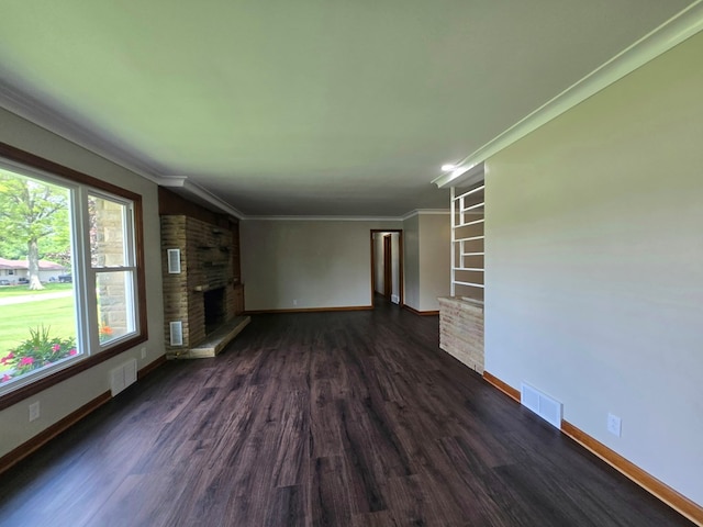 423 Beechwood Dr, Galion, OH 44833 - unfurnished living room with baseboards, dark wood-type flooring, a fireplace, and ornamental molding