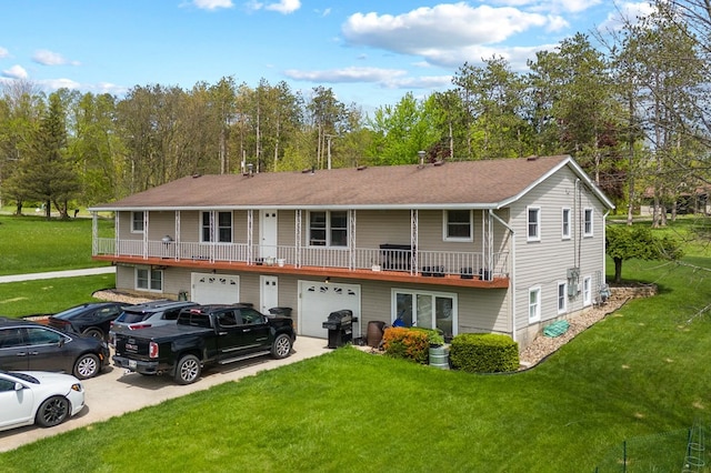 524.526 Rudy Rd, Mansfield, OH 44903 - view of front facade with an attached garage, concrete driveway, a front lawn, and a shingled roof