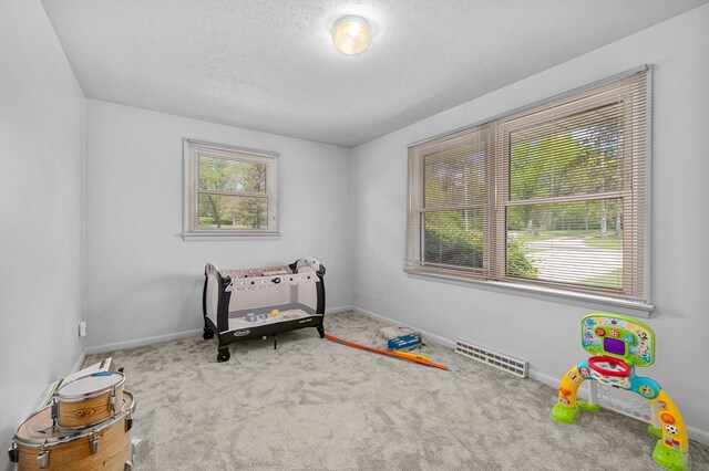 524.526 Rudy Rd, Mansfield, OH 44903 - carpeted bedroom with multiple windows, baseboards, and a textured ceiling