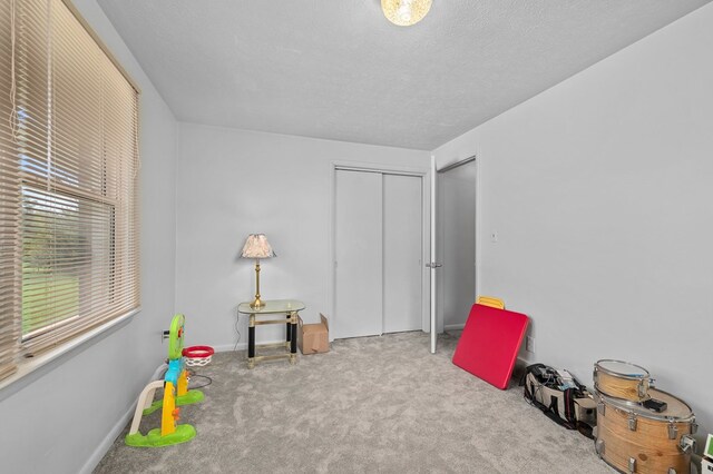 524.526 Rudy Rd, Mansfield, OH 44903 - game room featuring carpet, a textured ceiling, and baseboards