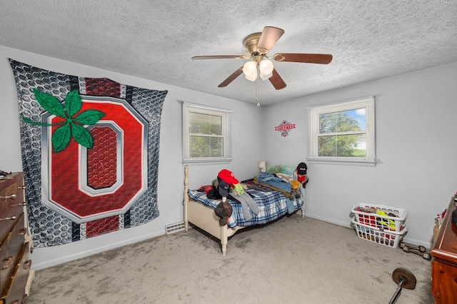 524.526 Rudy Rd, Mansfield, OH 44903 - bedroom featuring multiple windows, carpet, a textured ceiling, baseboards, and a ceiling fan