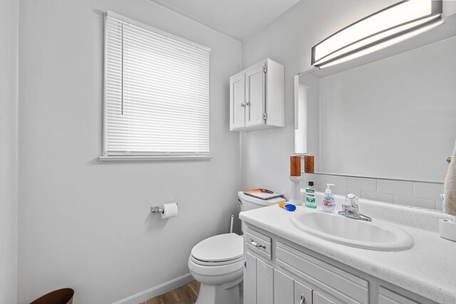 524.526 Rudy Rd, Mansfield, OH 44903 - bathroom with toilet, wood finished floors, vanity, and baseboards